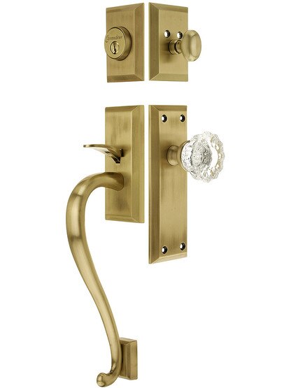 Fifth Avenue Entry Lock Set in Antique Brass Finish with Versailles Knob and